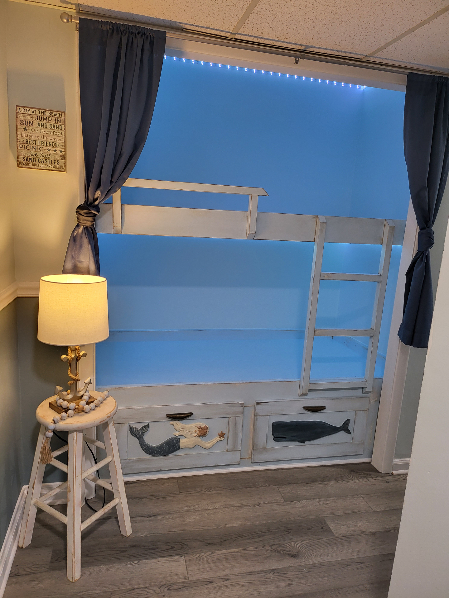 Wide view of the nook with curtains hung and lights installed.