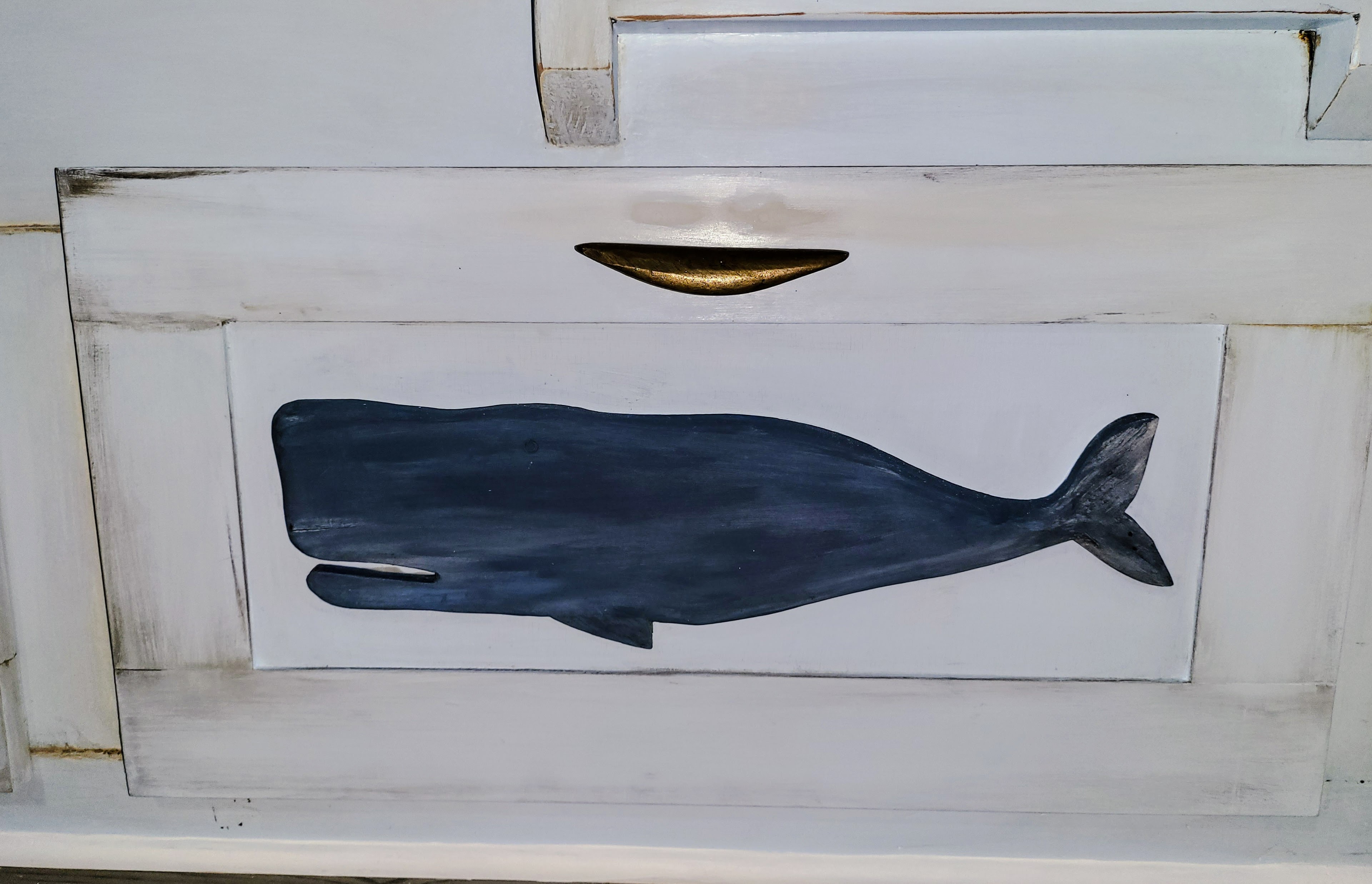 Close-up of the hand-painted whale drawer.