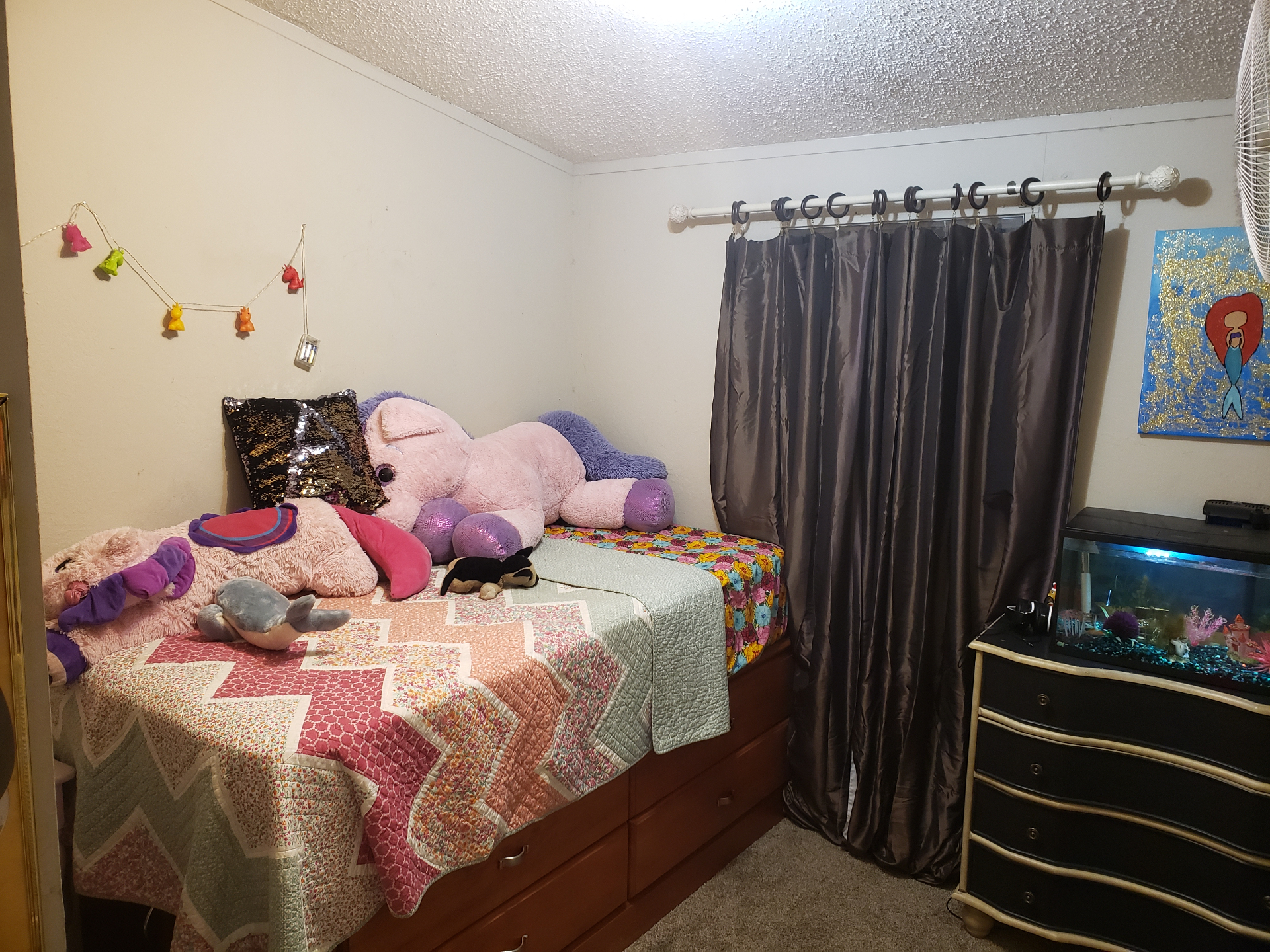 A crowded little bedroom in need of a rethink.