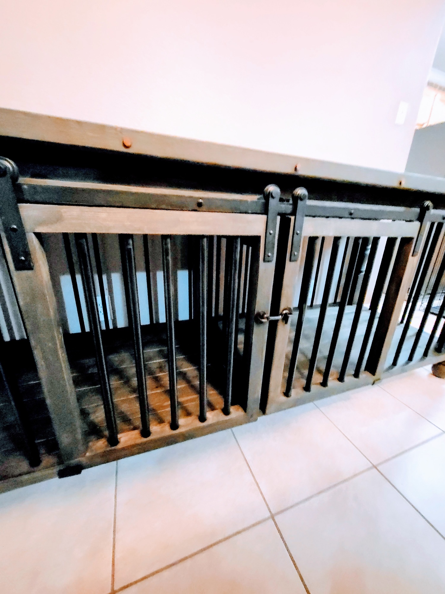 Hand-forged hardware and dark metal bars.