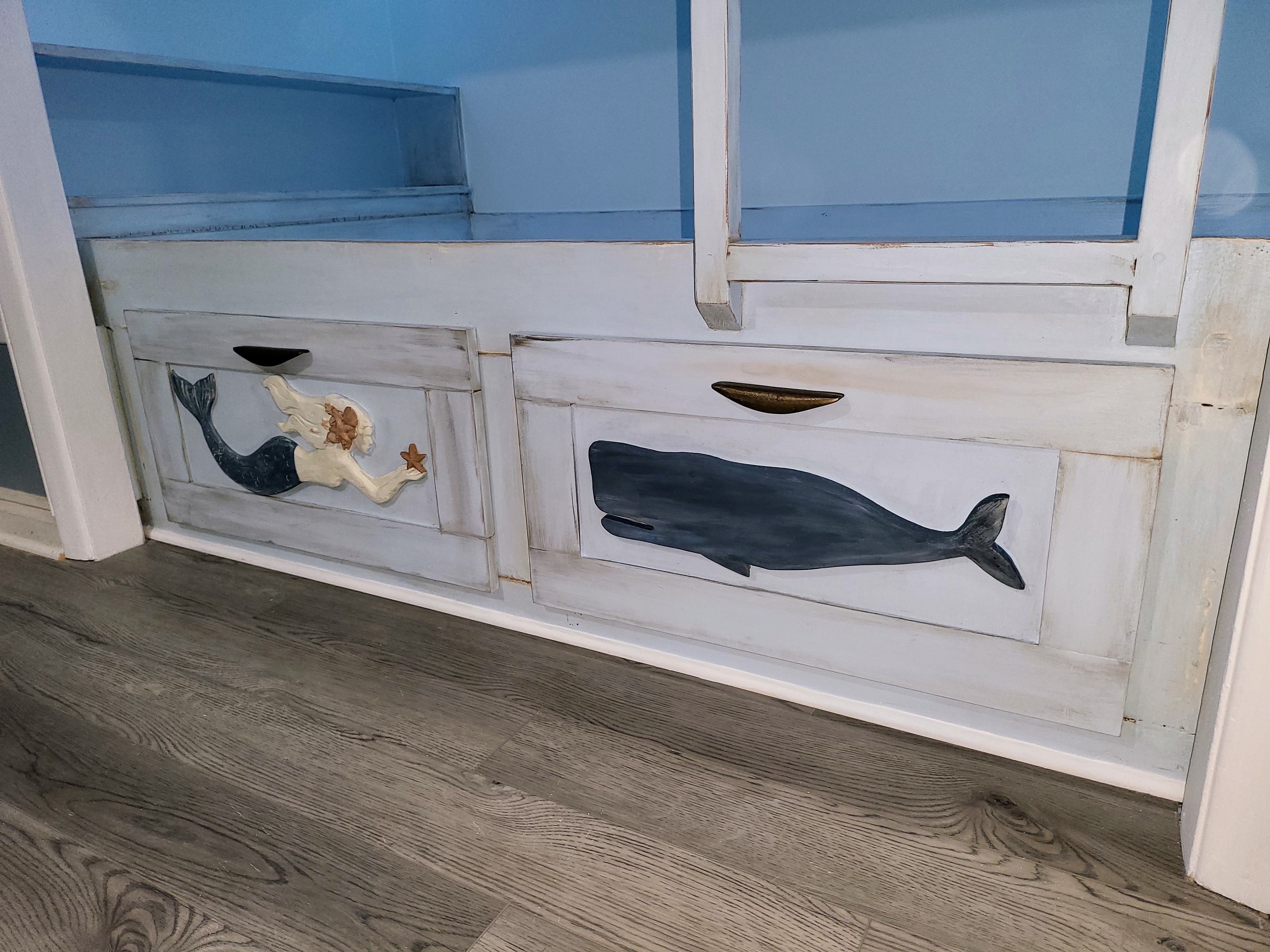 Hand-painted mermaid and whale drawers turned ordinary storage into artwork.