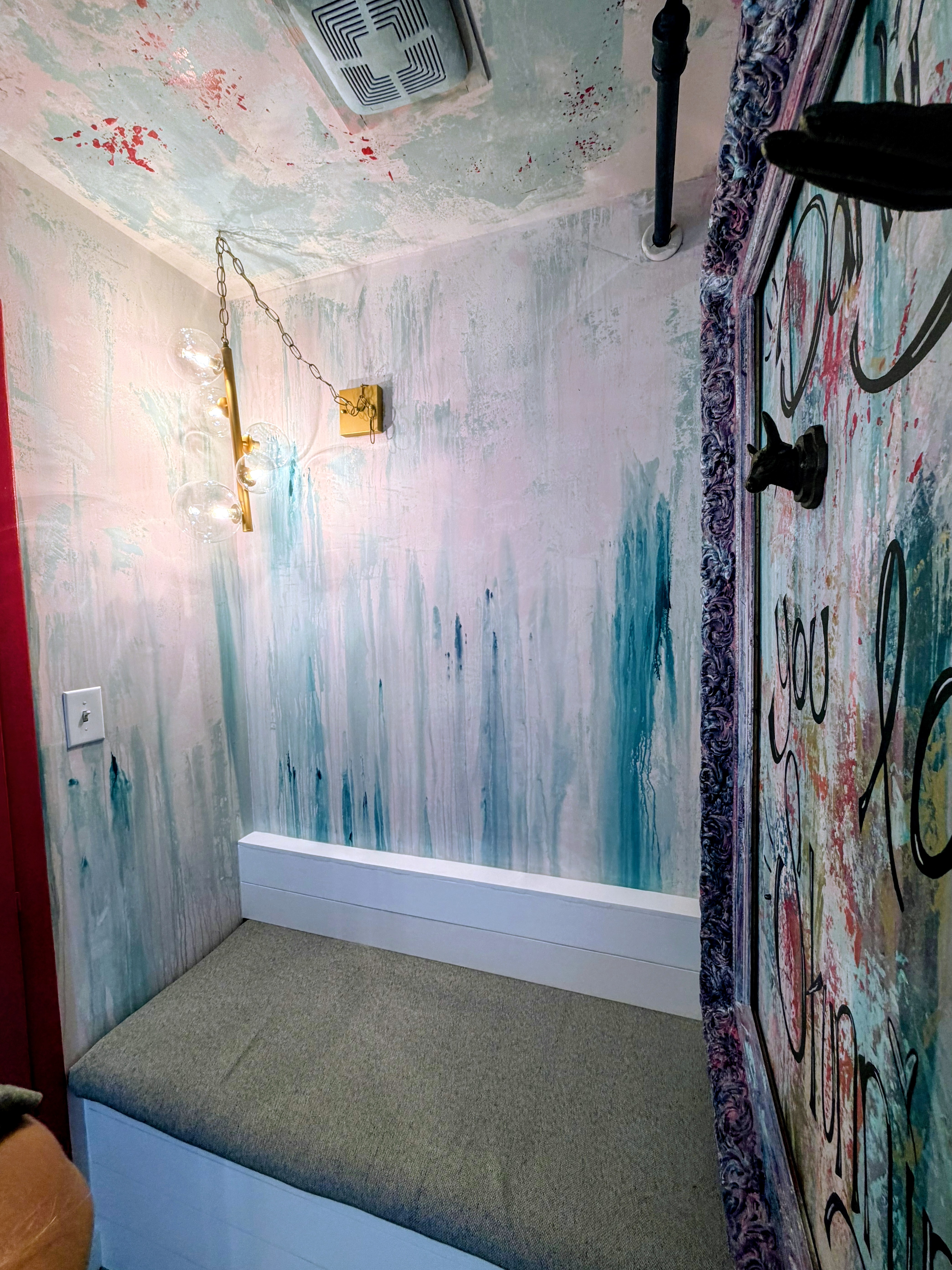 Custom bench and softly weathered wall finish inside the new dressing room.