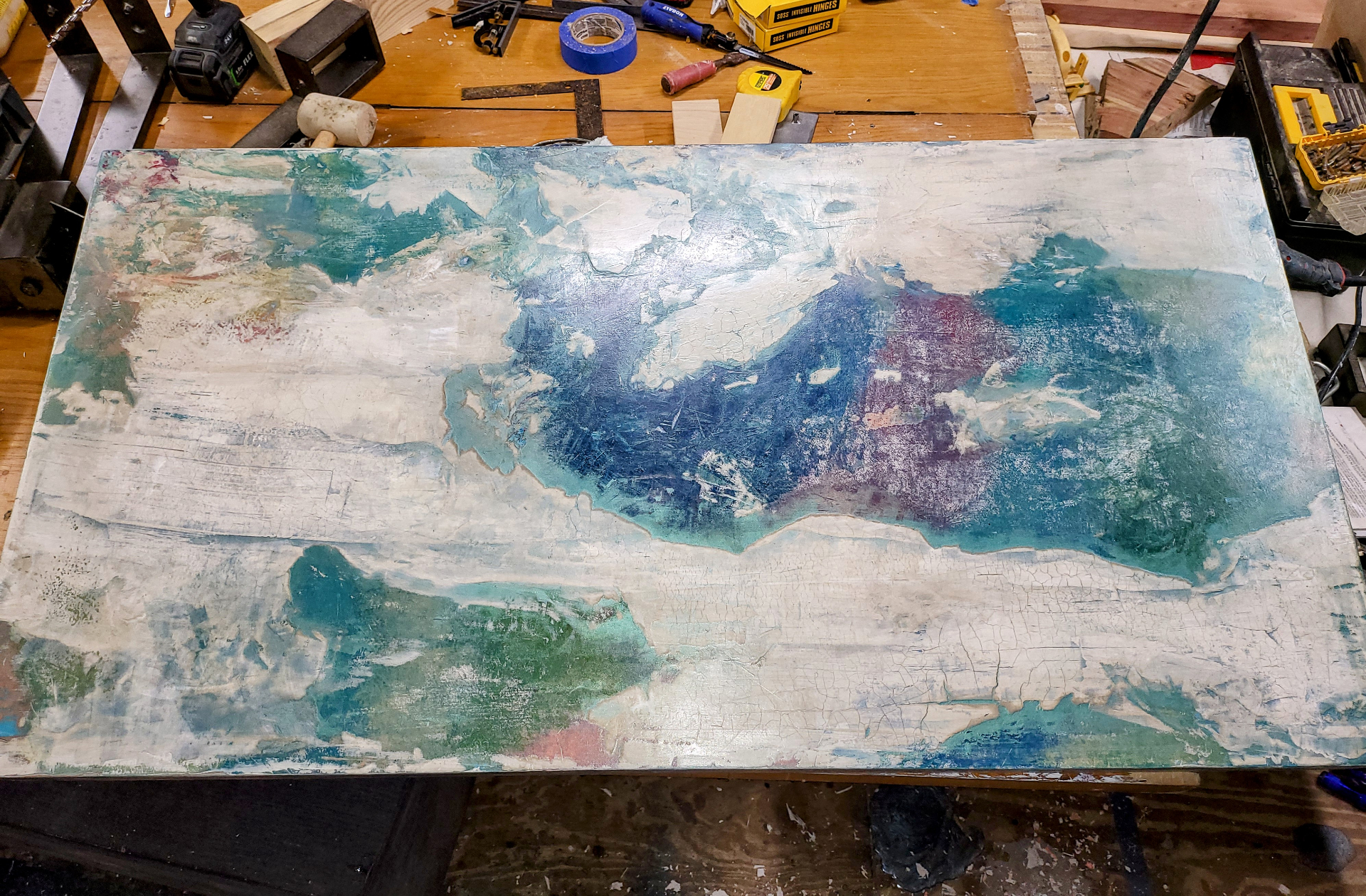 Mid-finish on the workbench — the patina taking shape.