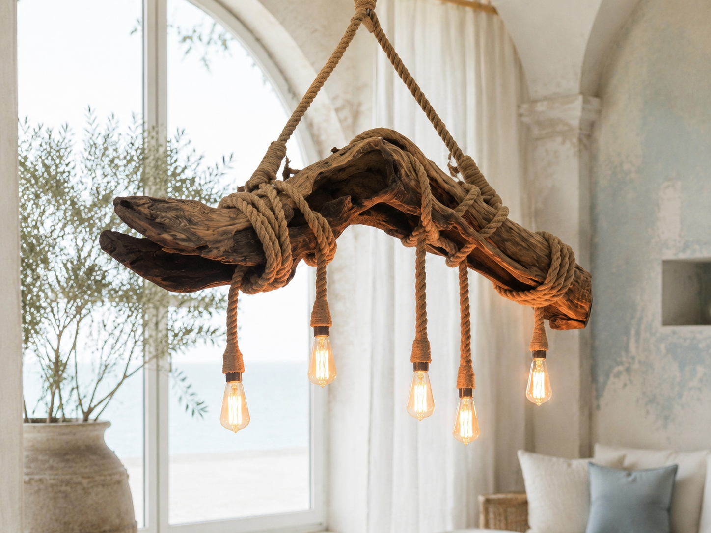 Left angle — the natural sweep of the driftwood and hand-worked rope rigging.
