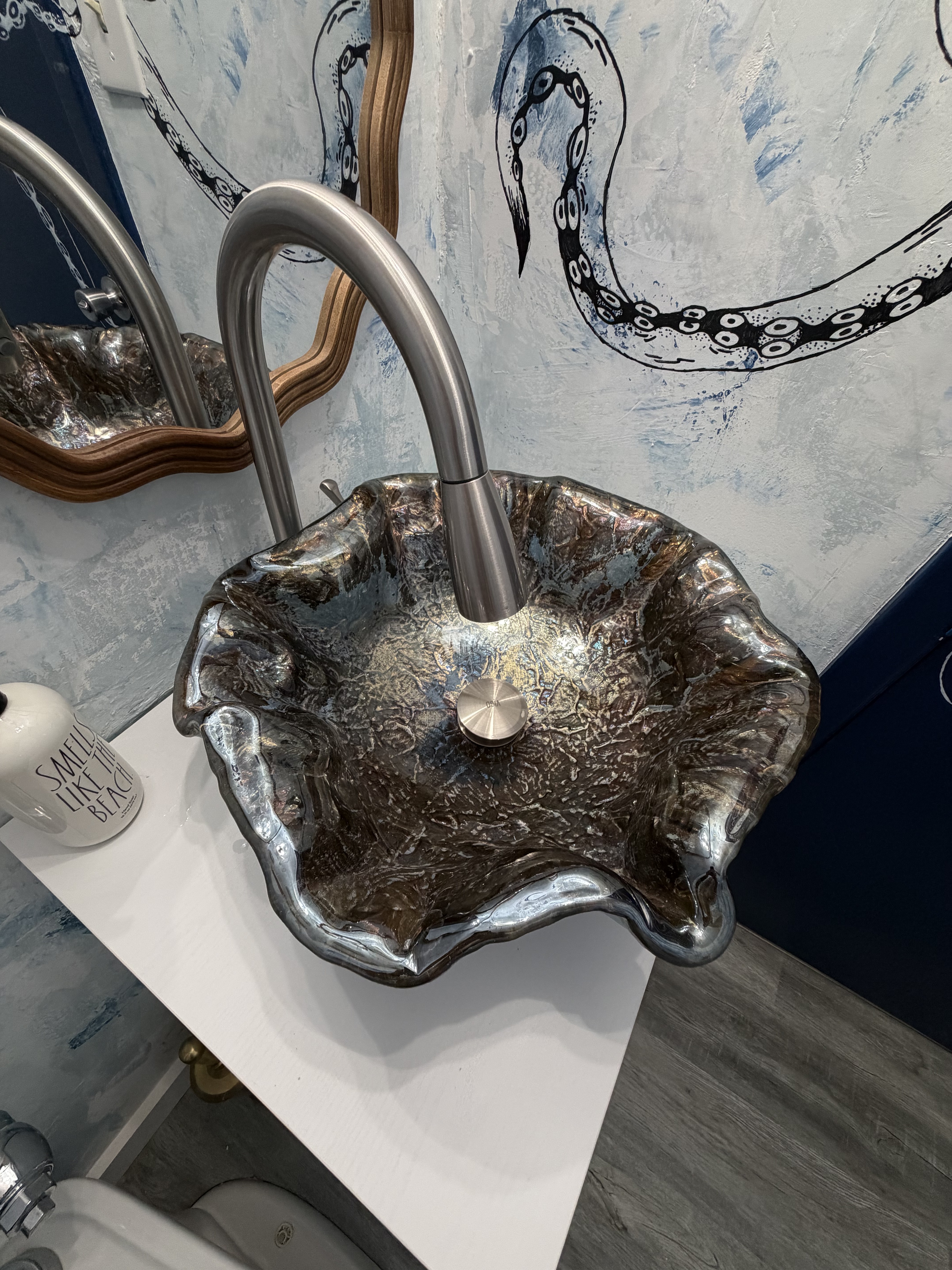 Sculptural sink detail inside the underwater-meets-shipwreck escape.
