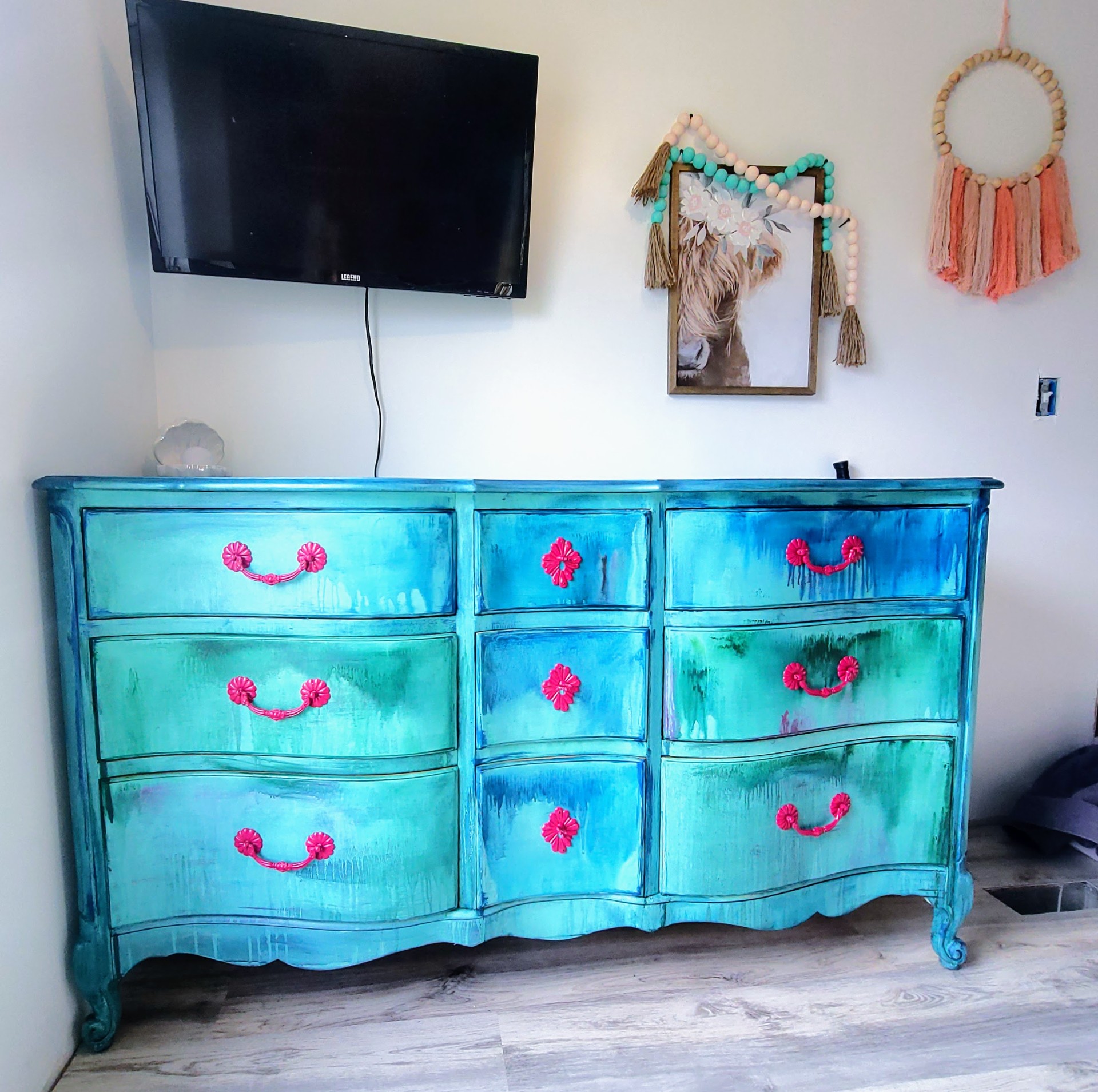 Hand-finished dresser in layered turquoise with coral hardware.