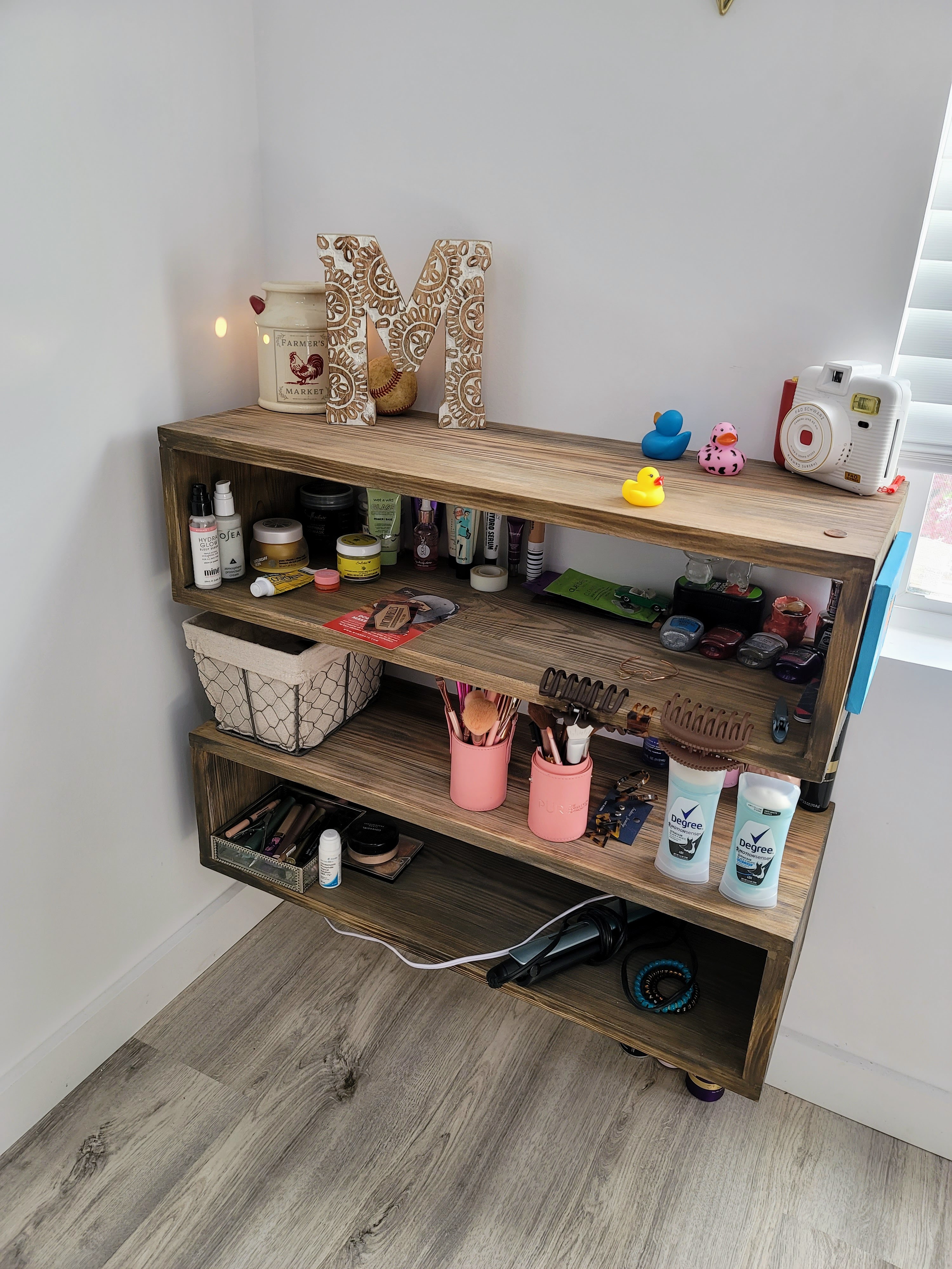 Custom shelving tucked into the room for everyday essentials.