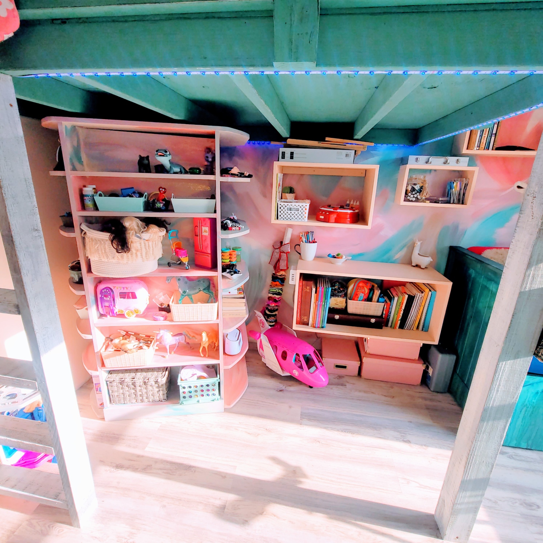 Custom shelving — a colorful hideaway for books, toys and treasures.